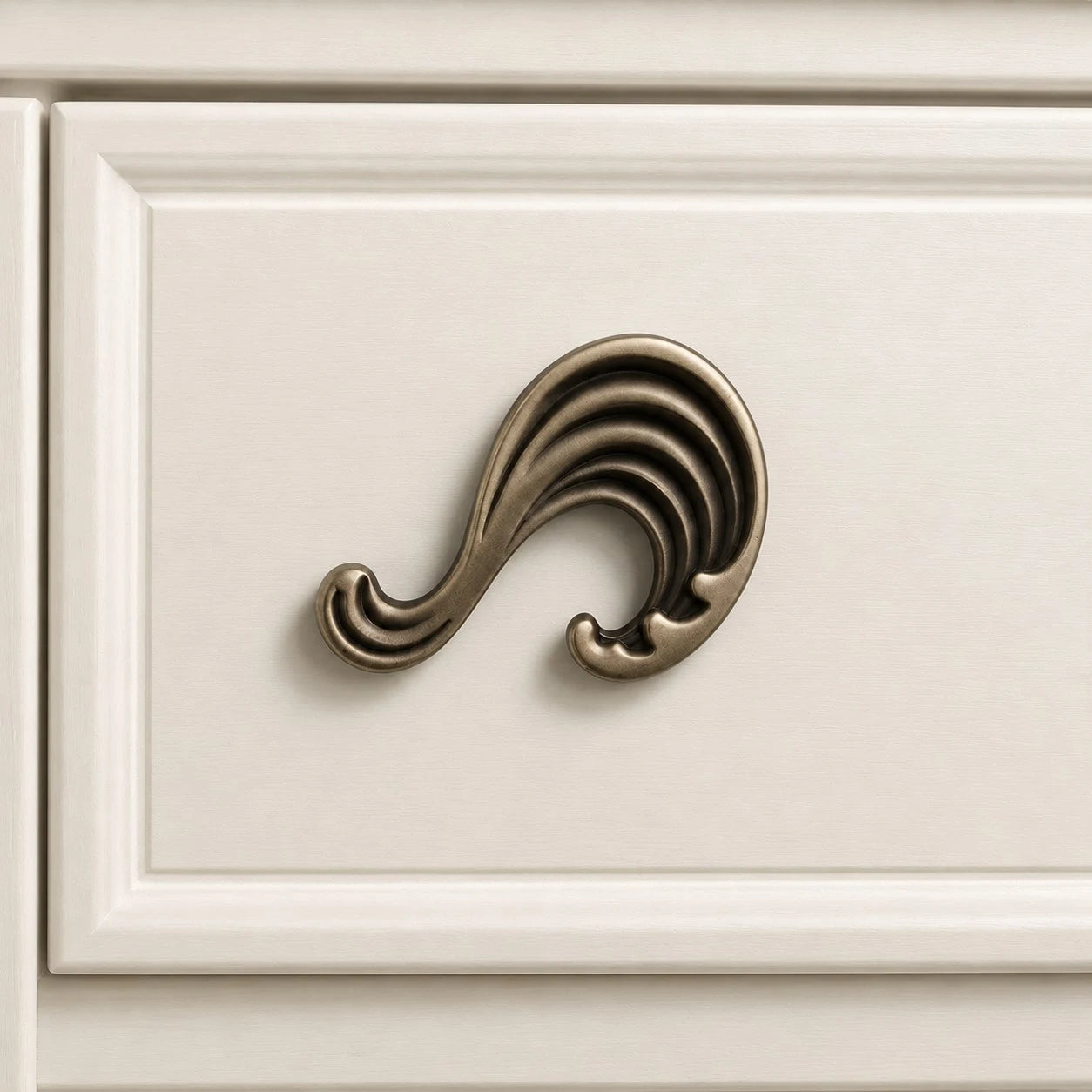 Wave cabinet knob in Antique Brass