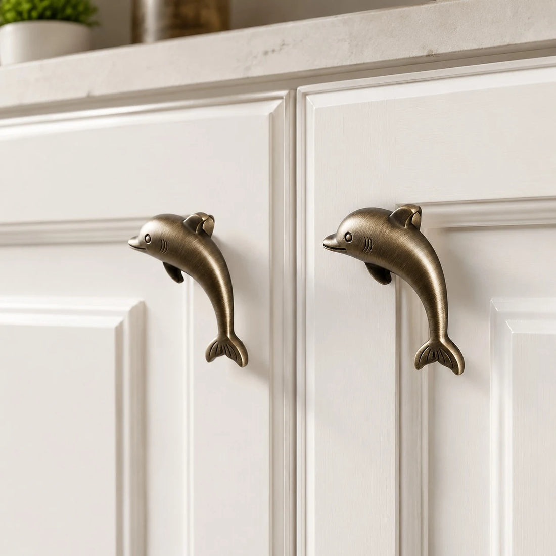 Dolphin Antique Brass cabinet knob installed scene