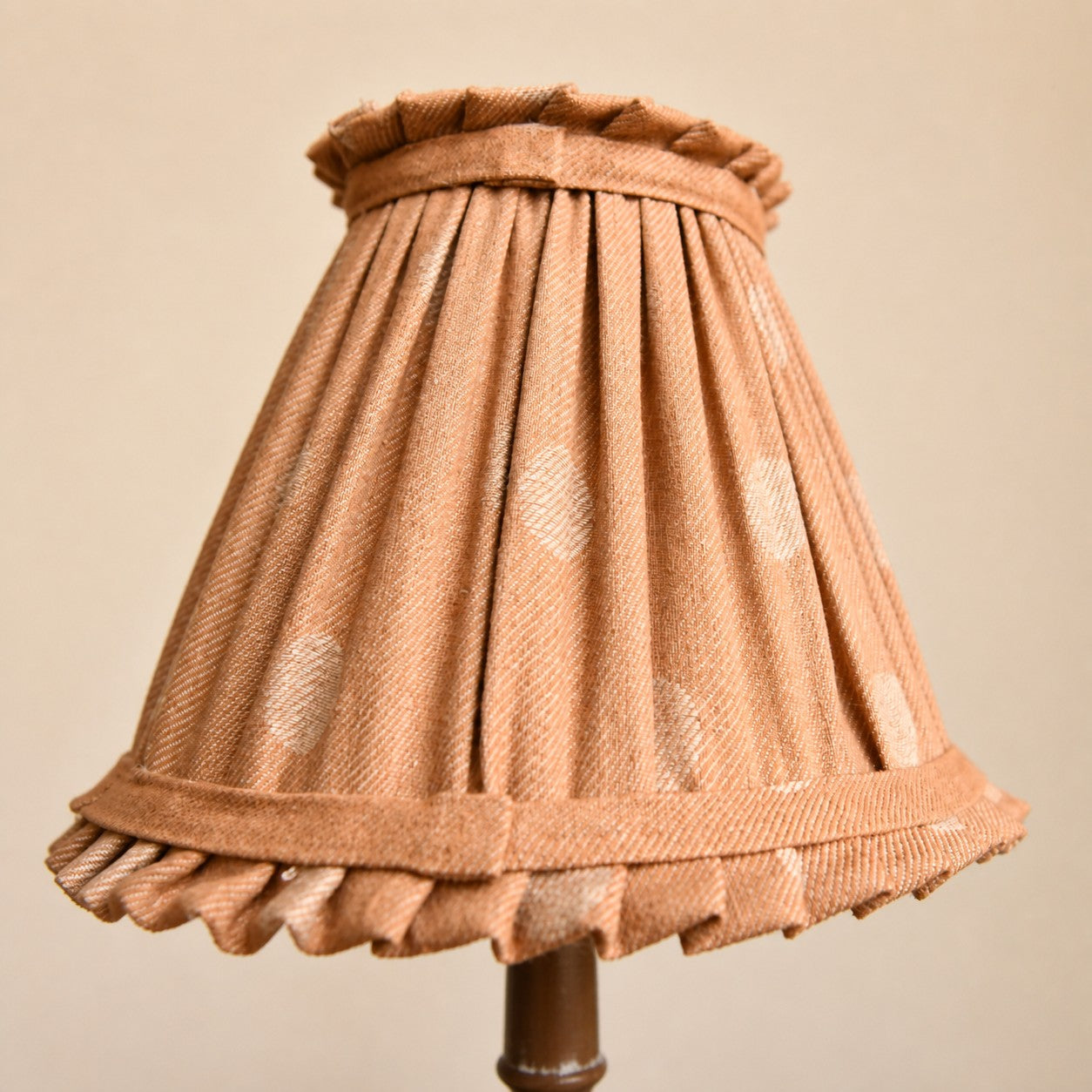 Pleated cloth lampshade close detail on French country table lamp