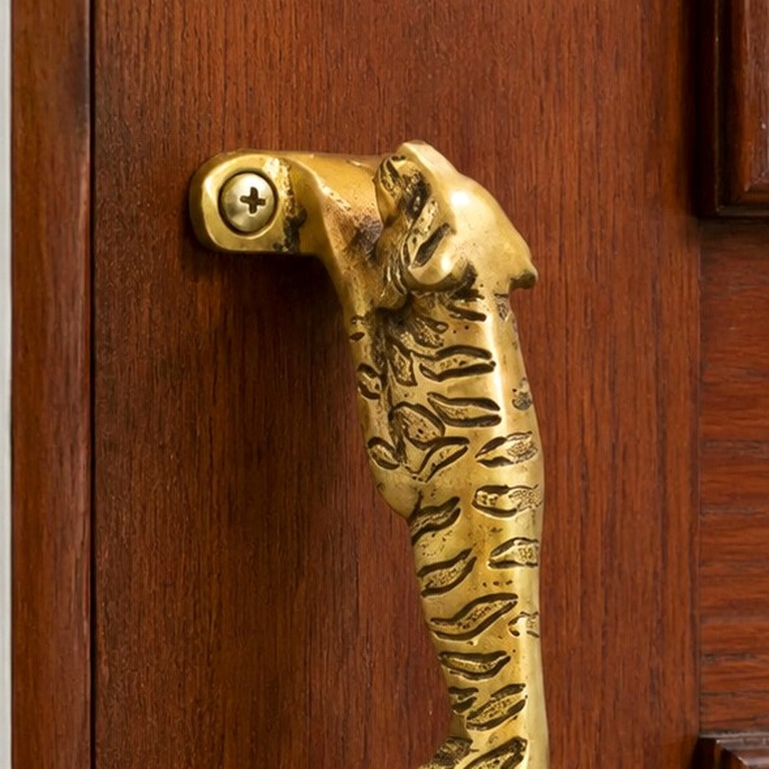 Leopard A brass cabinet handle close-up detail