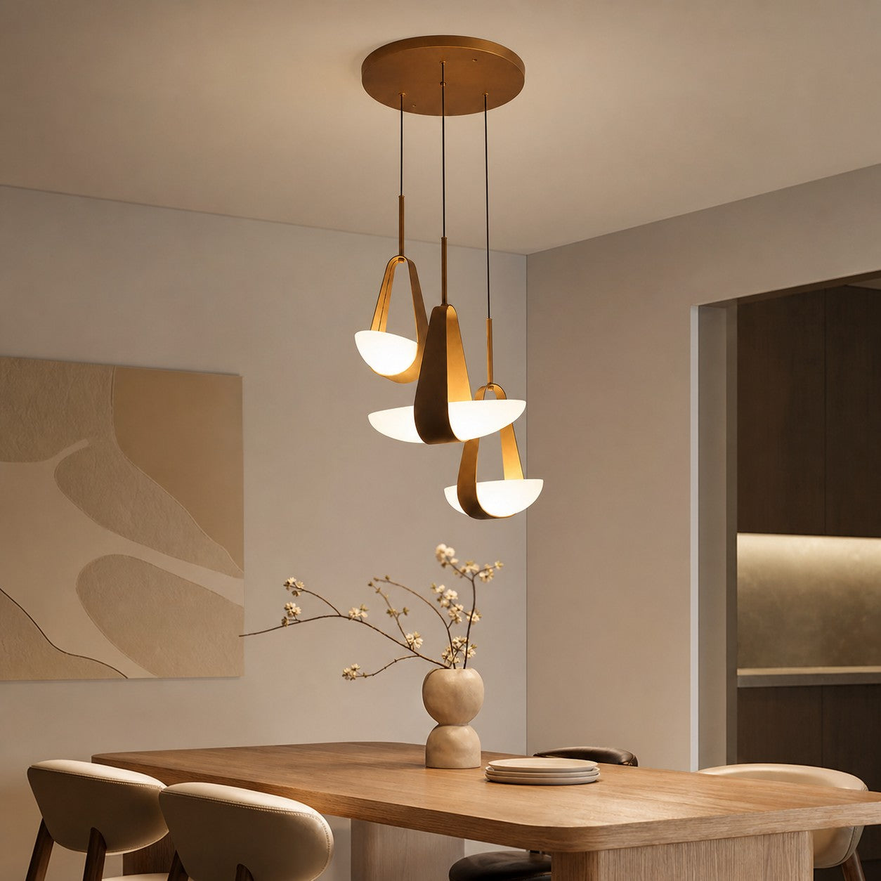 Triple sailboat leather pendant above a dining table