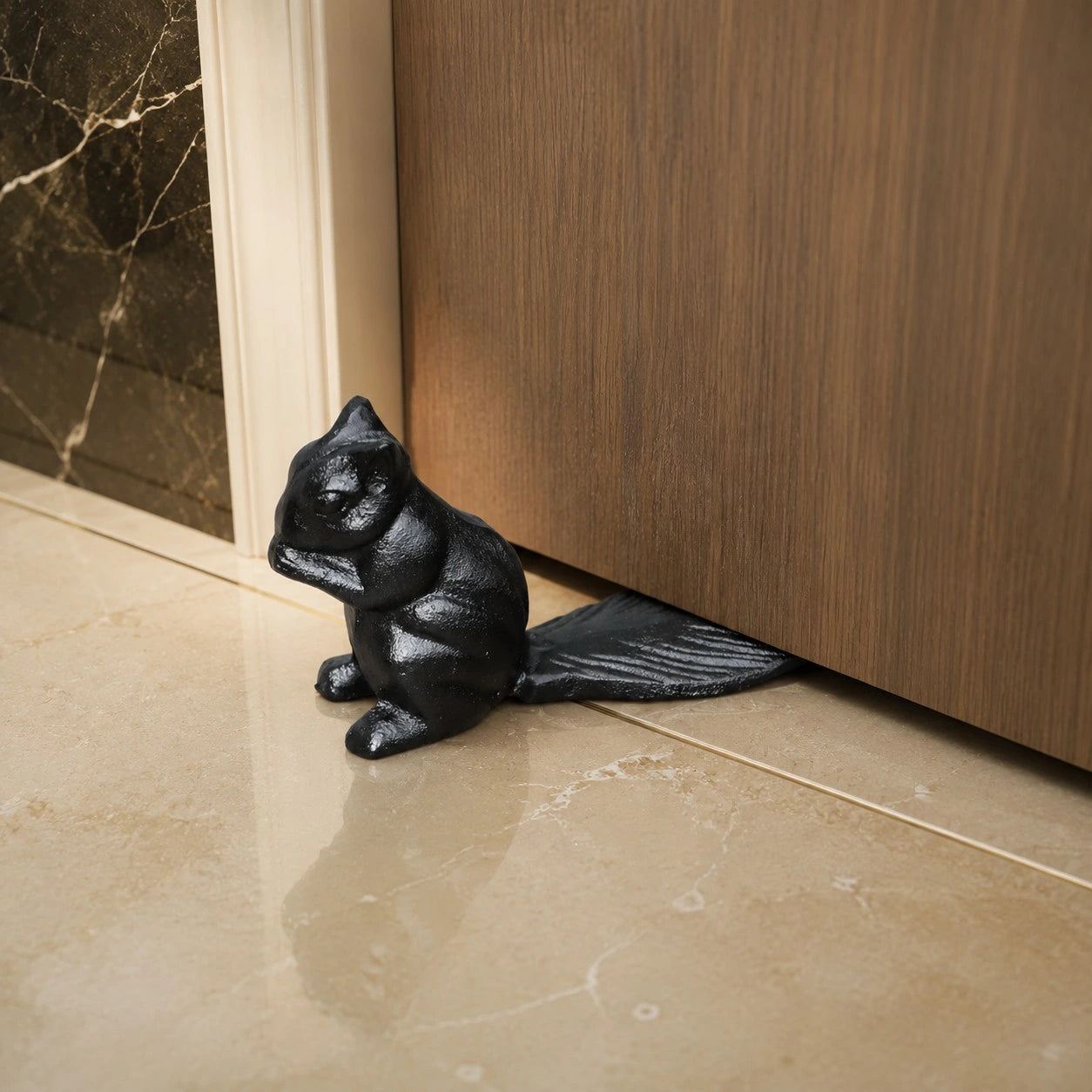 Iron Black Guardian door stopper under a wood door
