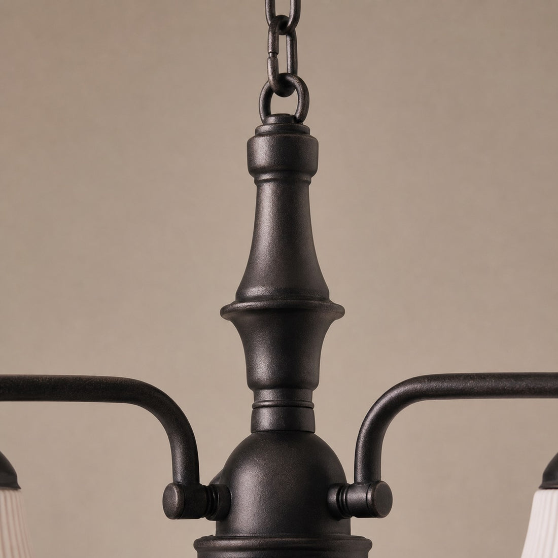 Close view of black iron center column and chain