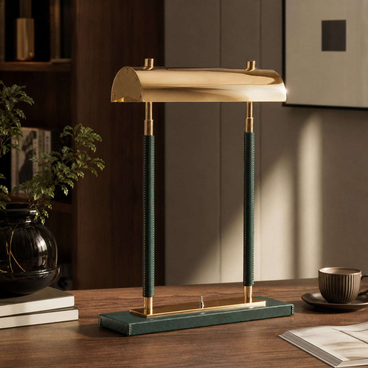 Green leather table lamp on a wood desk