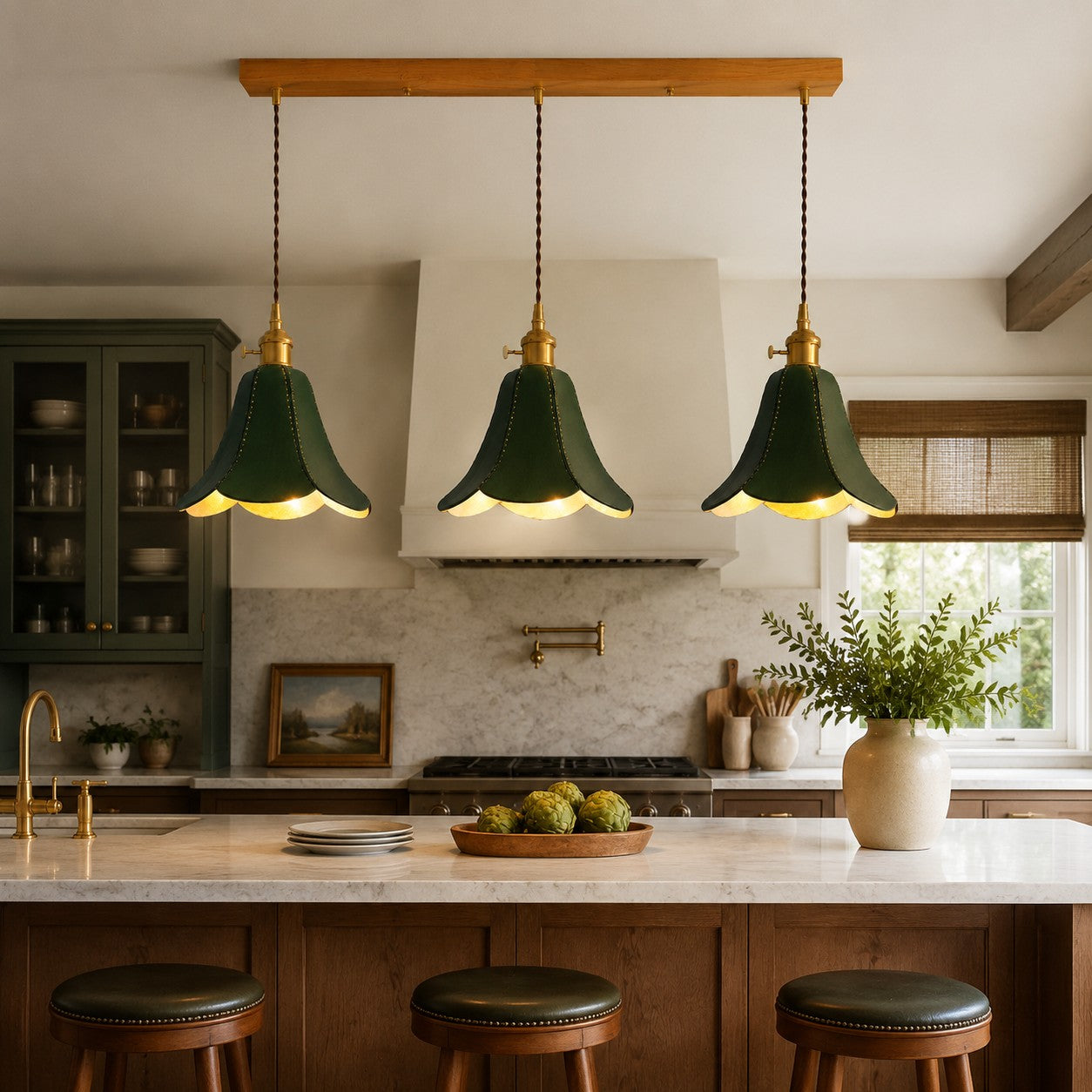 Green triple pendant above a kitchen island