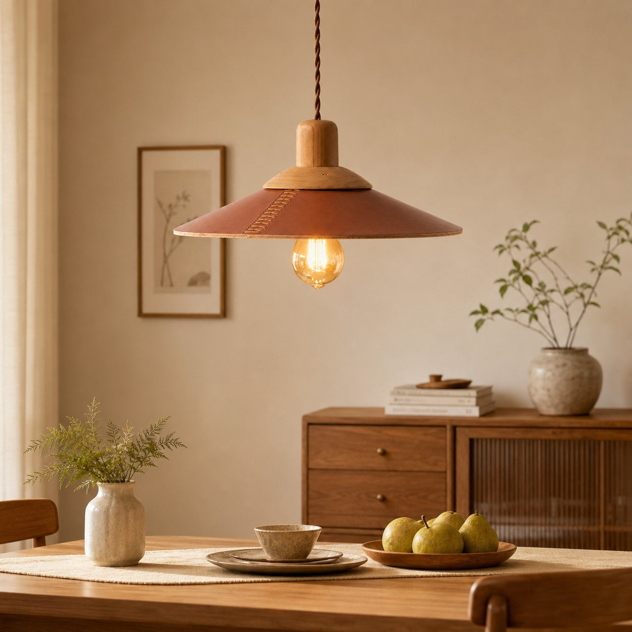 Brown leather pendant above a wood dining table