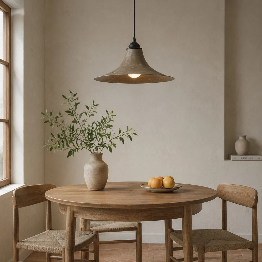 Black iron pendant lamp in a compact dining corner