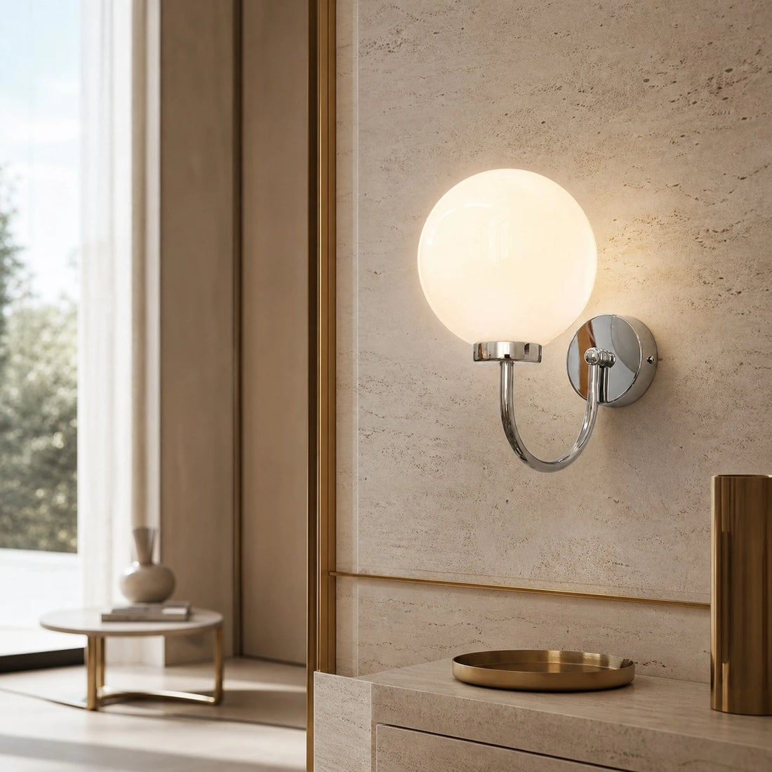 Style B Chrome Luma wall sconce in a stone interior
