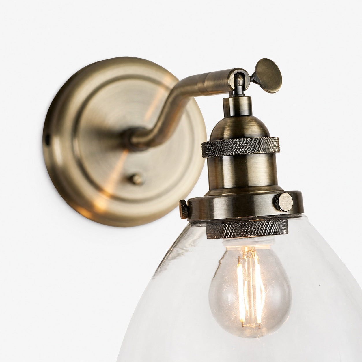 Adjustable Hansen Brass Wall Sconce - Clear Glass Design