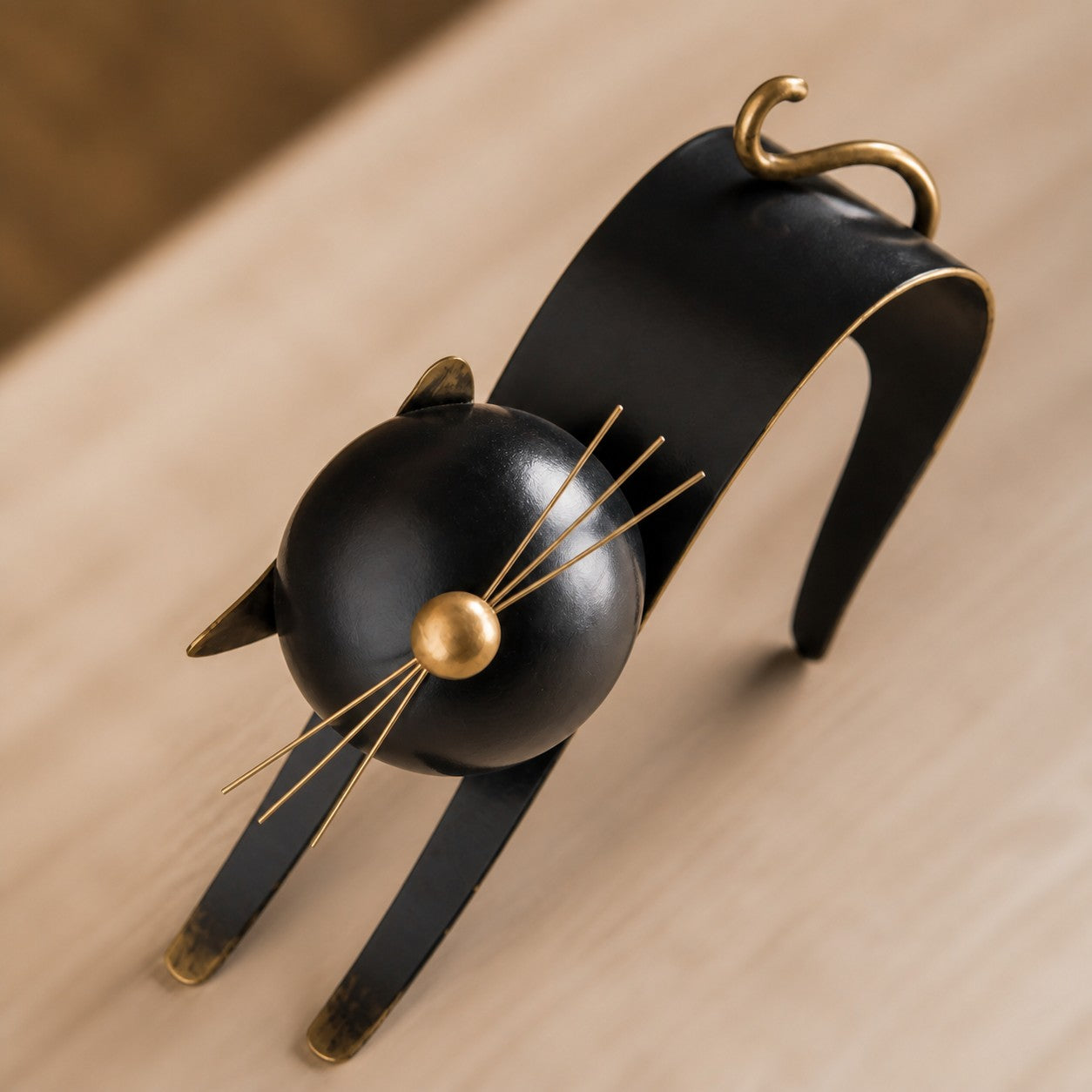 Felora sculptural metal cat figurine viewed from above