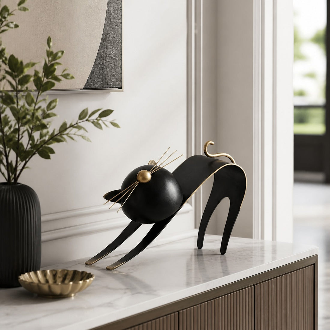 Felora sculptural metal cat figurine displayed on a console