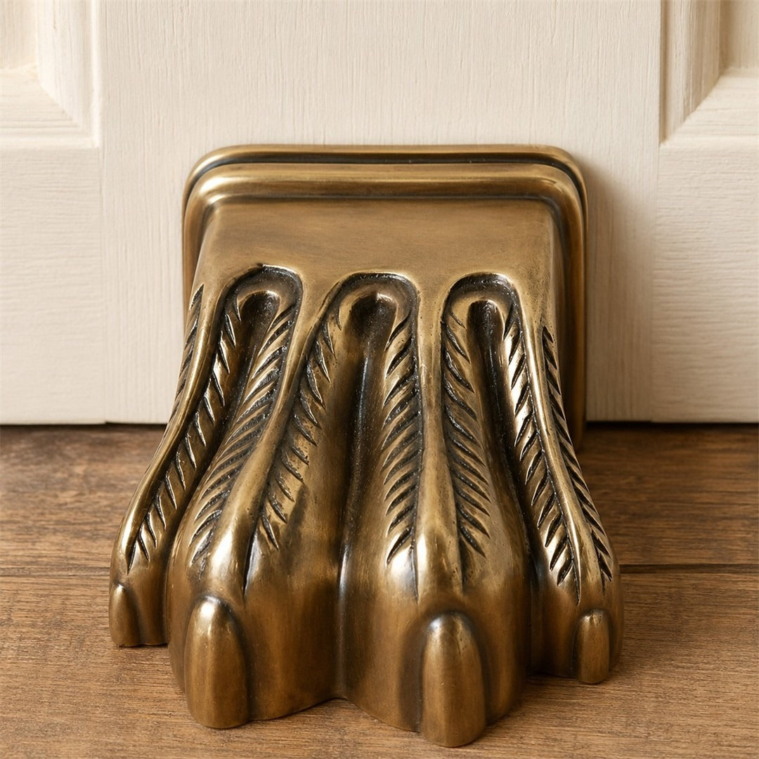 Guardian claw antique brass metal door stopper