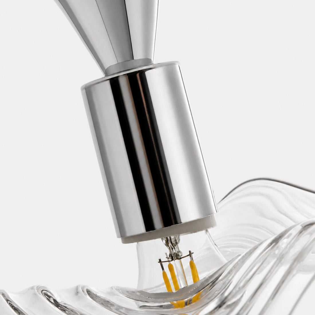 Chrome lamp holder and sculpted glass edge detail