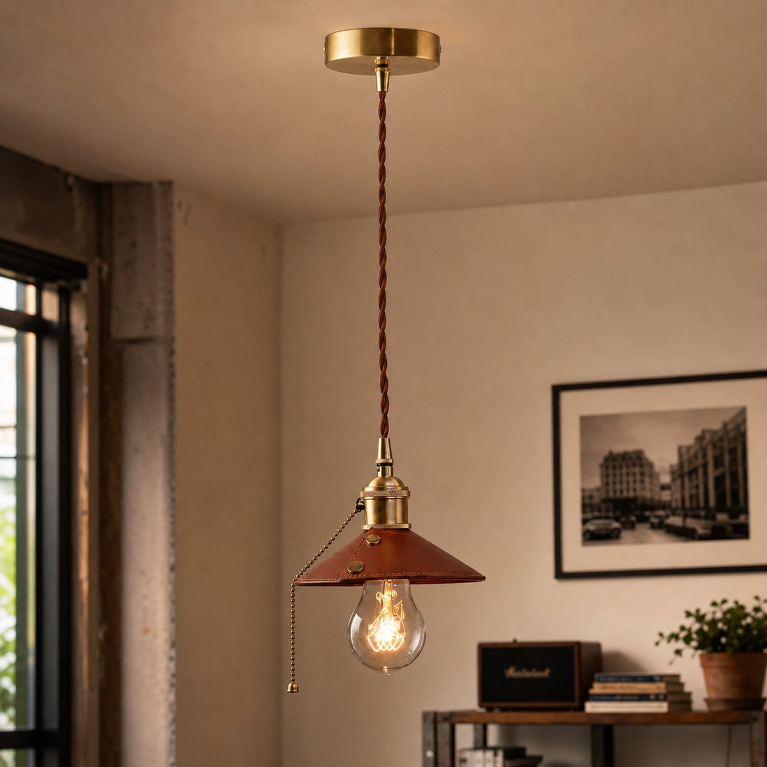 Brown leather pendant lamp in a warm interior