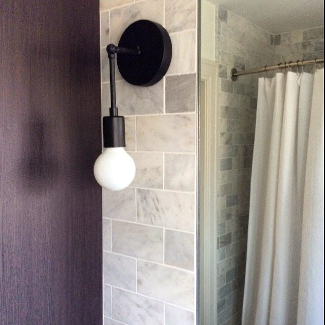 Black Swivel Functional Wall Sconce - Stylish Bedroom & Bathroom Accent