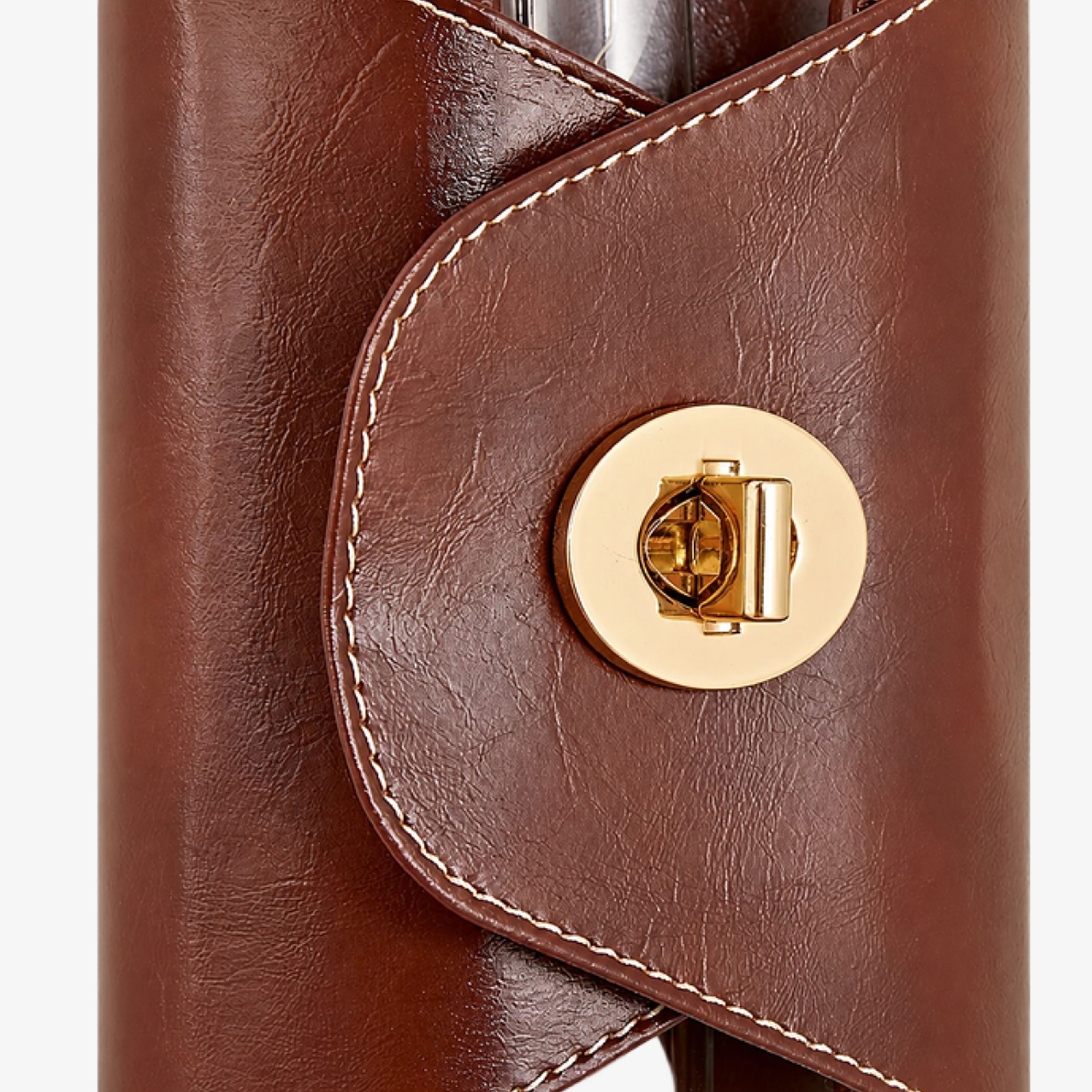 Brown leather stitching and round clasp detail