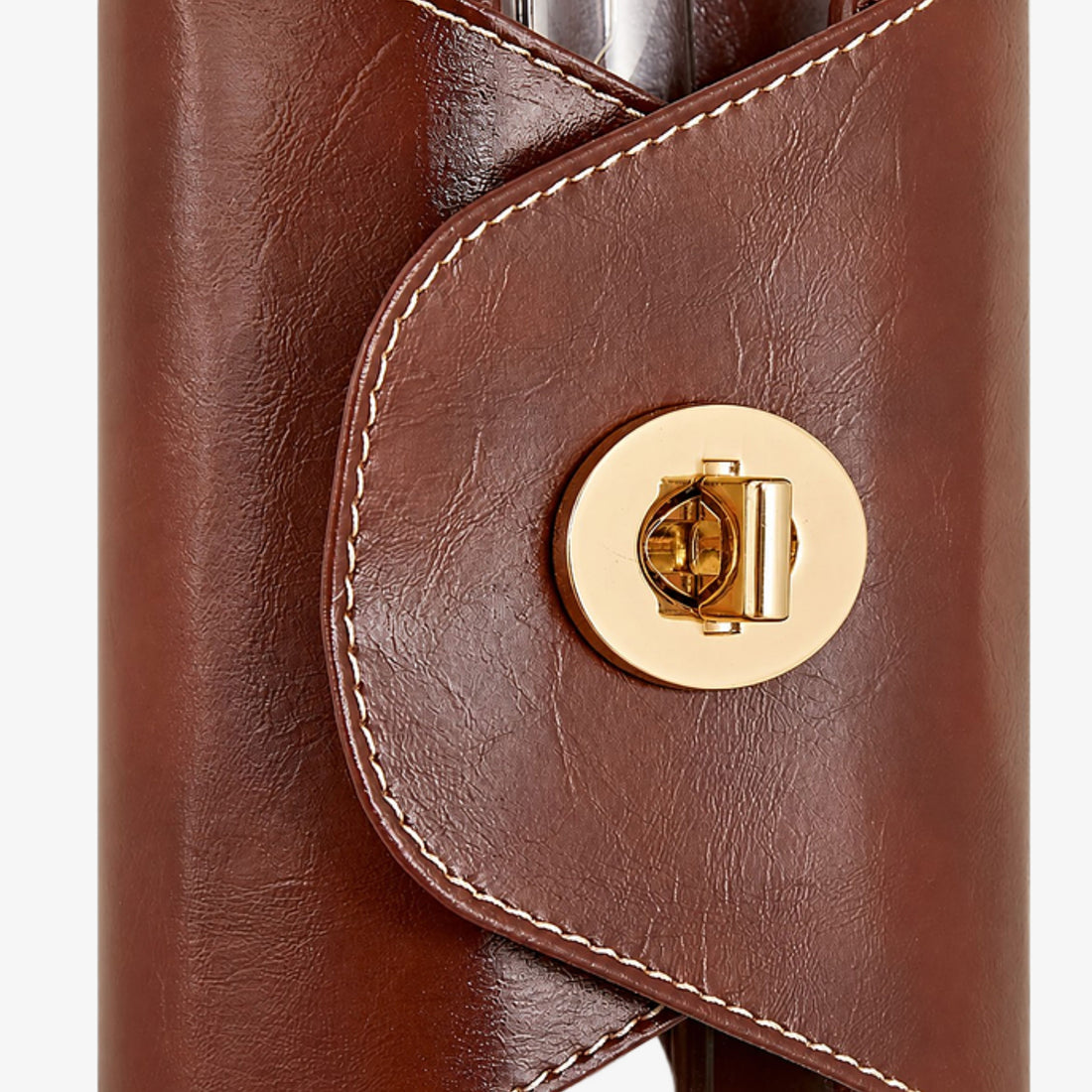 Brown leather stitching and round clasp detail