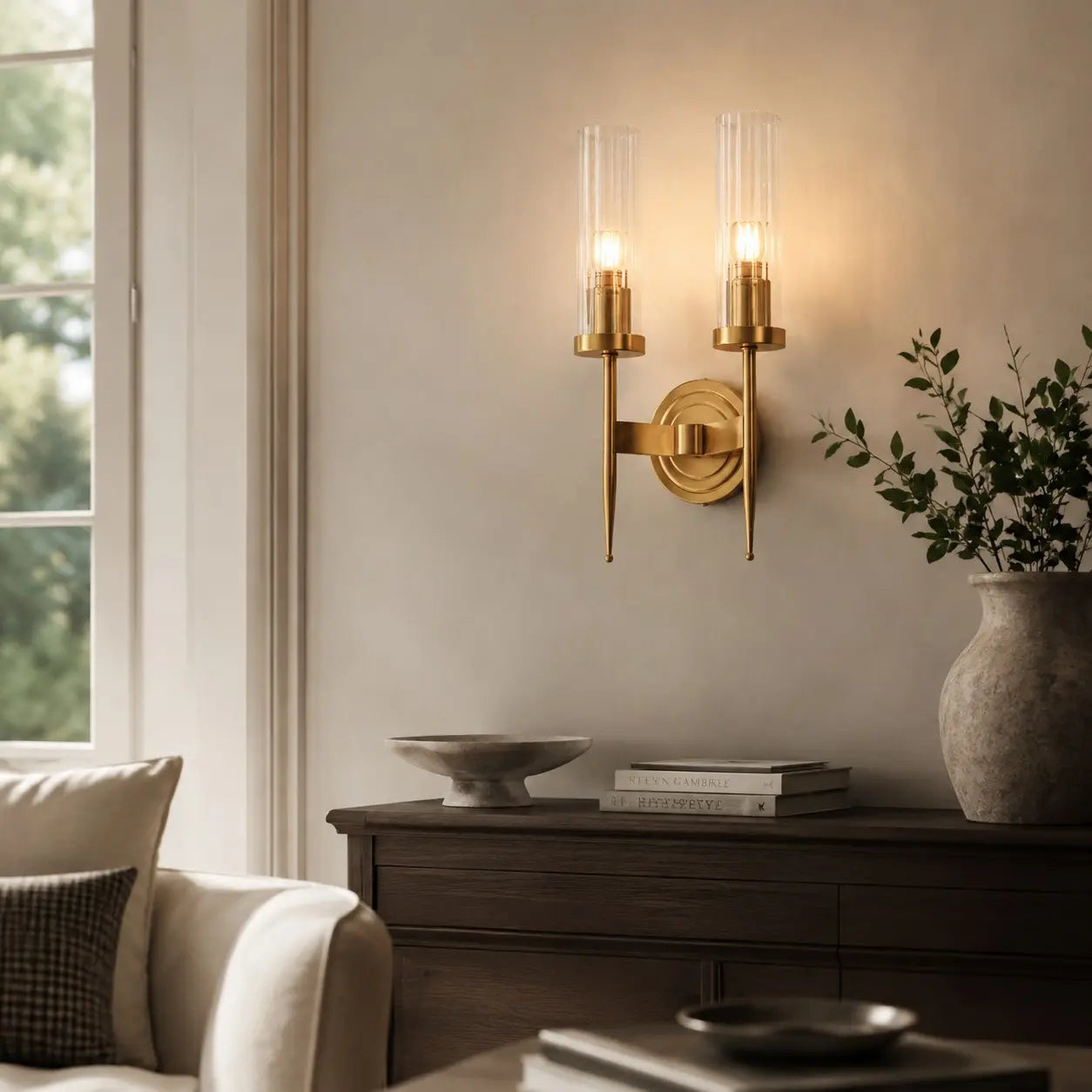 Double-head brass and glass wall lamp in a refined interior