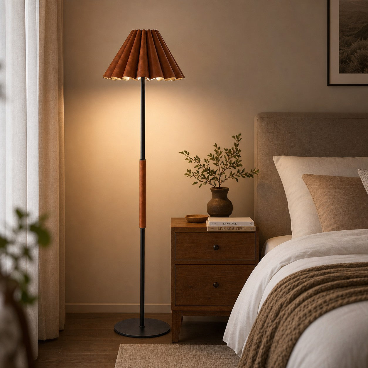 Pleated leather floor lamp illuminating a quiet corner