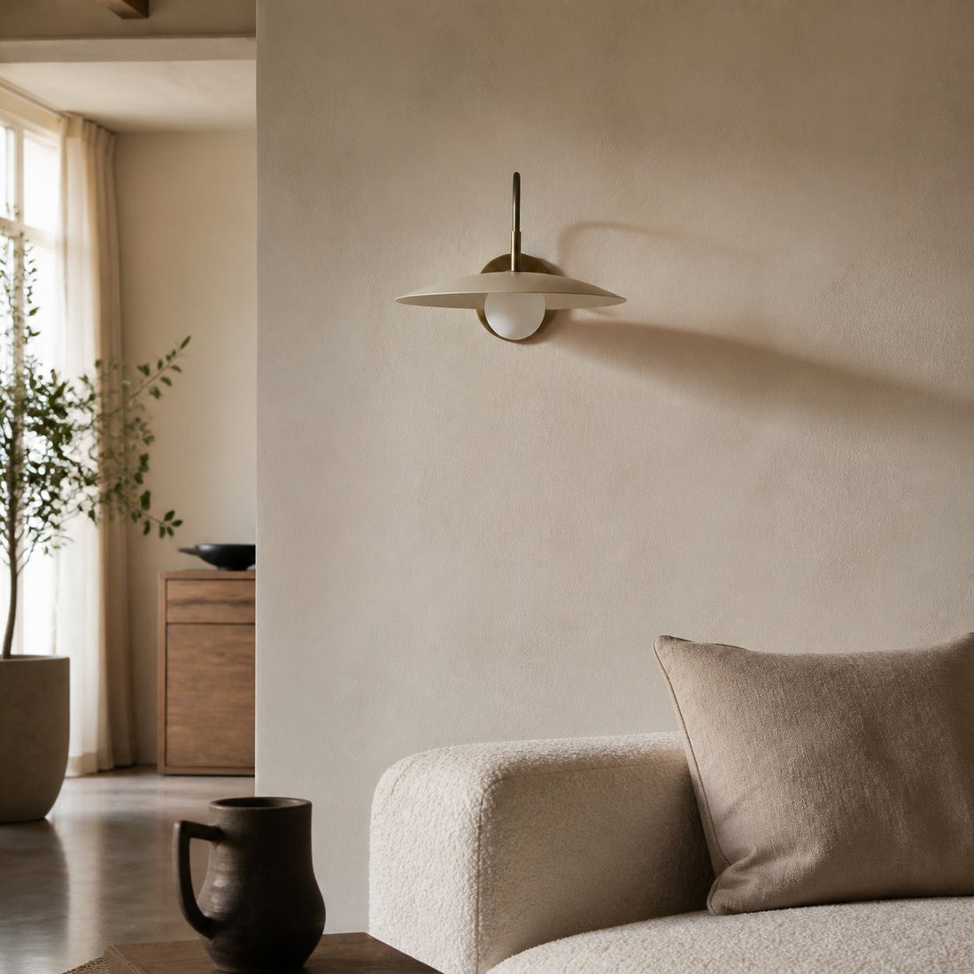Curva Metal Modern Wall Sconce - Antique Brass Arm with Cream Disc Shade