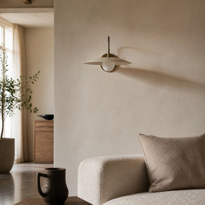 Curva Metal Modern Wall Sconce - Antique Brass Arm with Cream Disc Shade