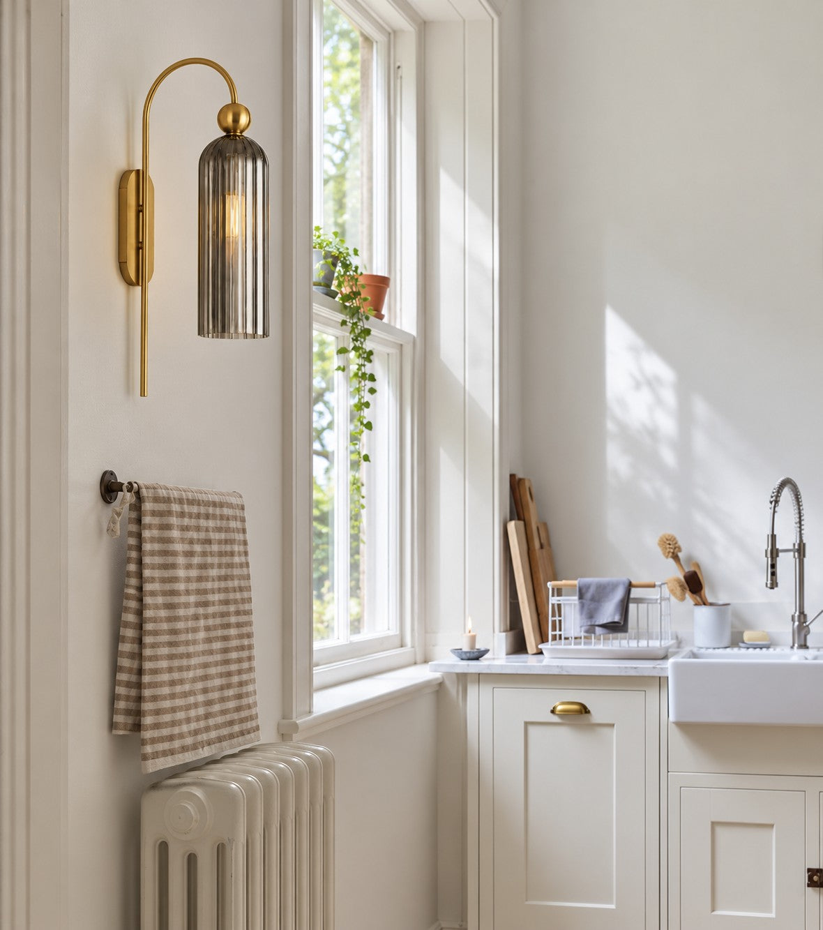 Aura gray glass wall sconce in a kitchen
