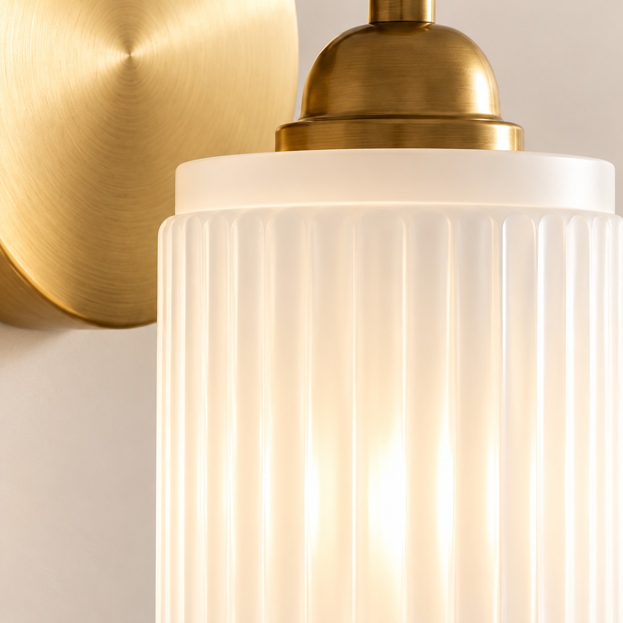 Aura vintage ribbed glass wall sconce shade and gold cap close-up