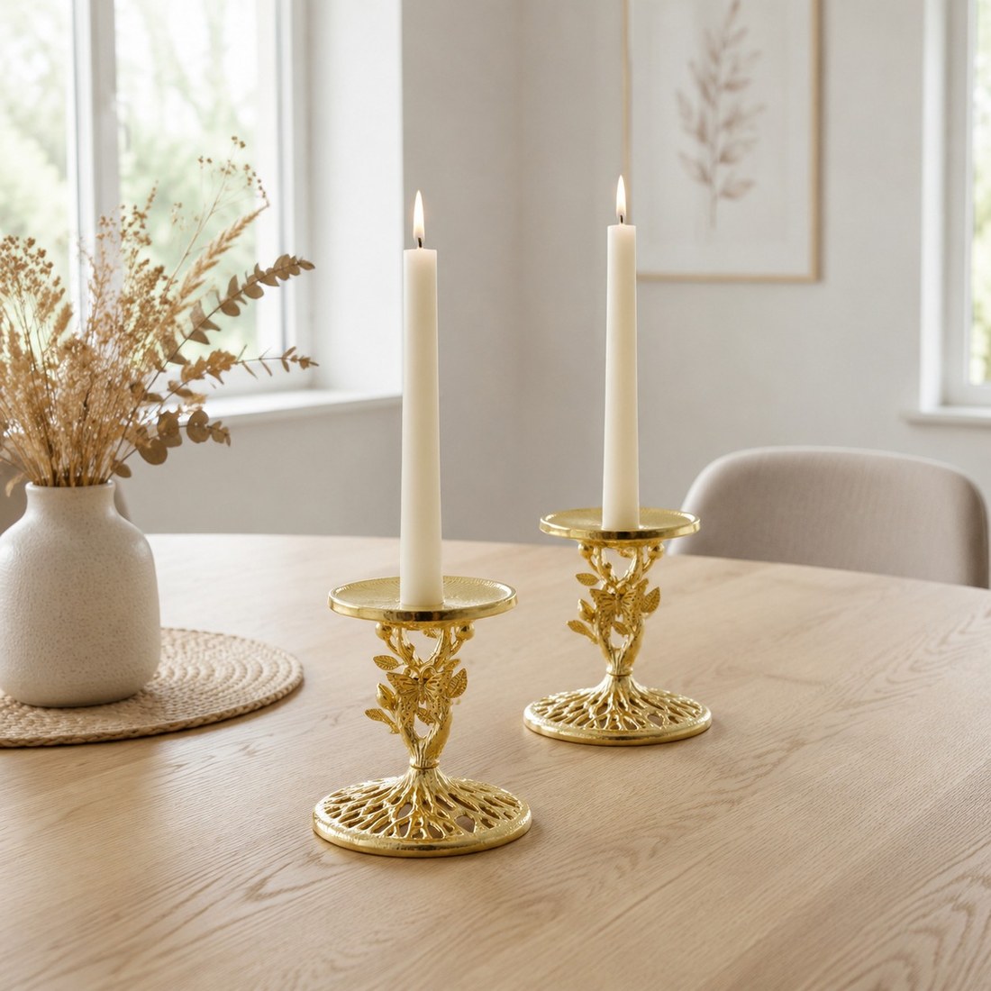 Two Aura gold candlesticks styled together