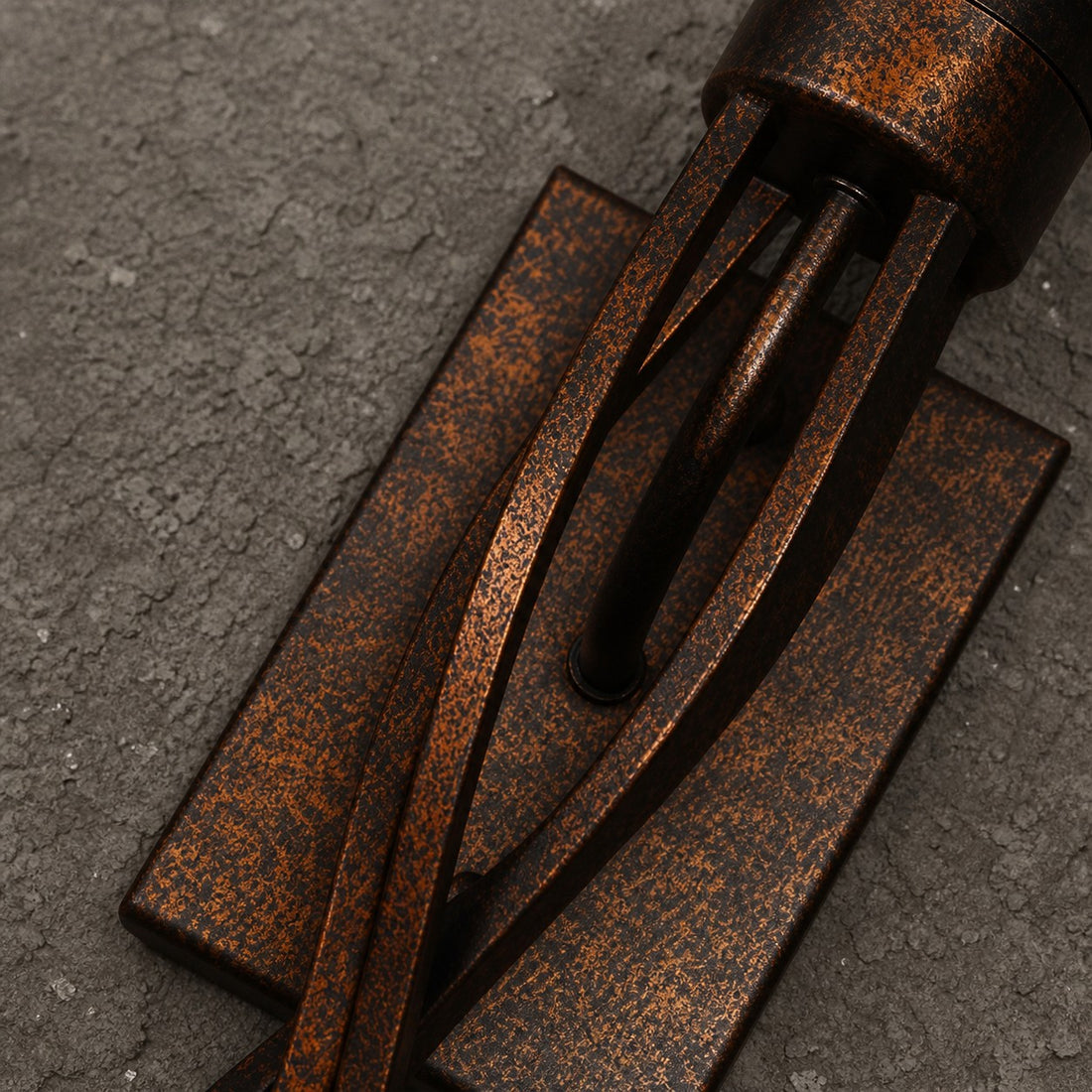 Close view of aged bronze metal texture and backplate