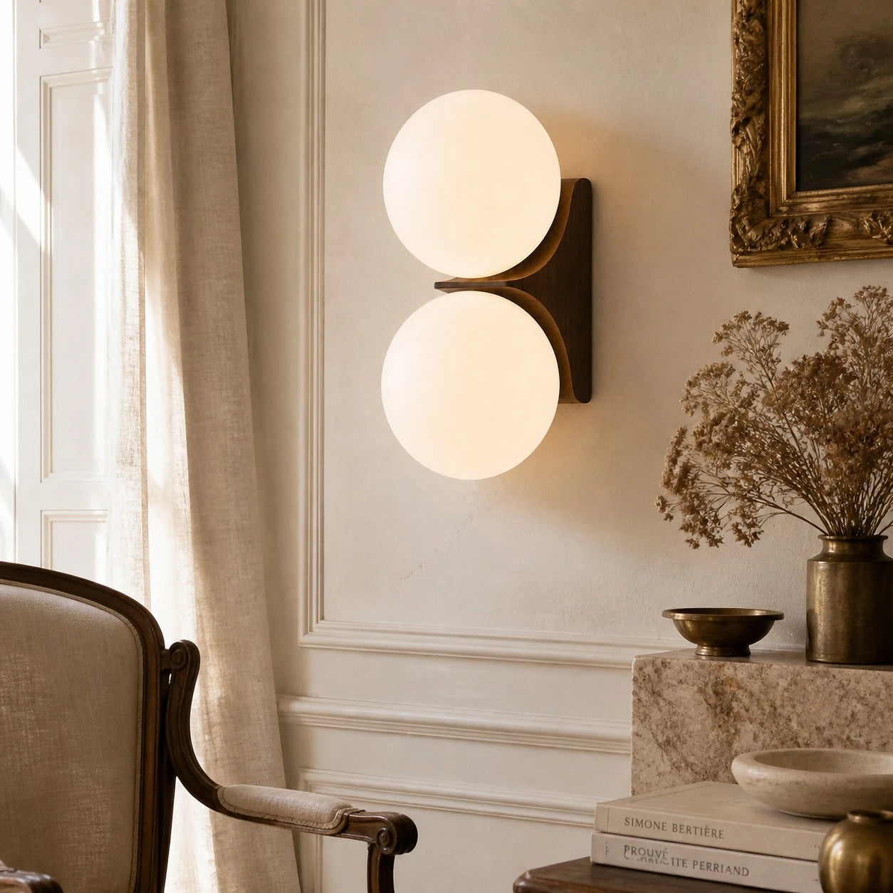 Two-head Walnut globe wall sconce in a refined lounge
