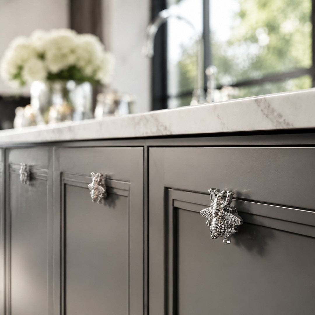 Chrome Totem bee handle on dark vanity cabinetry