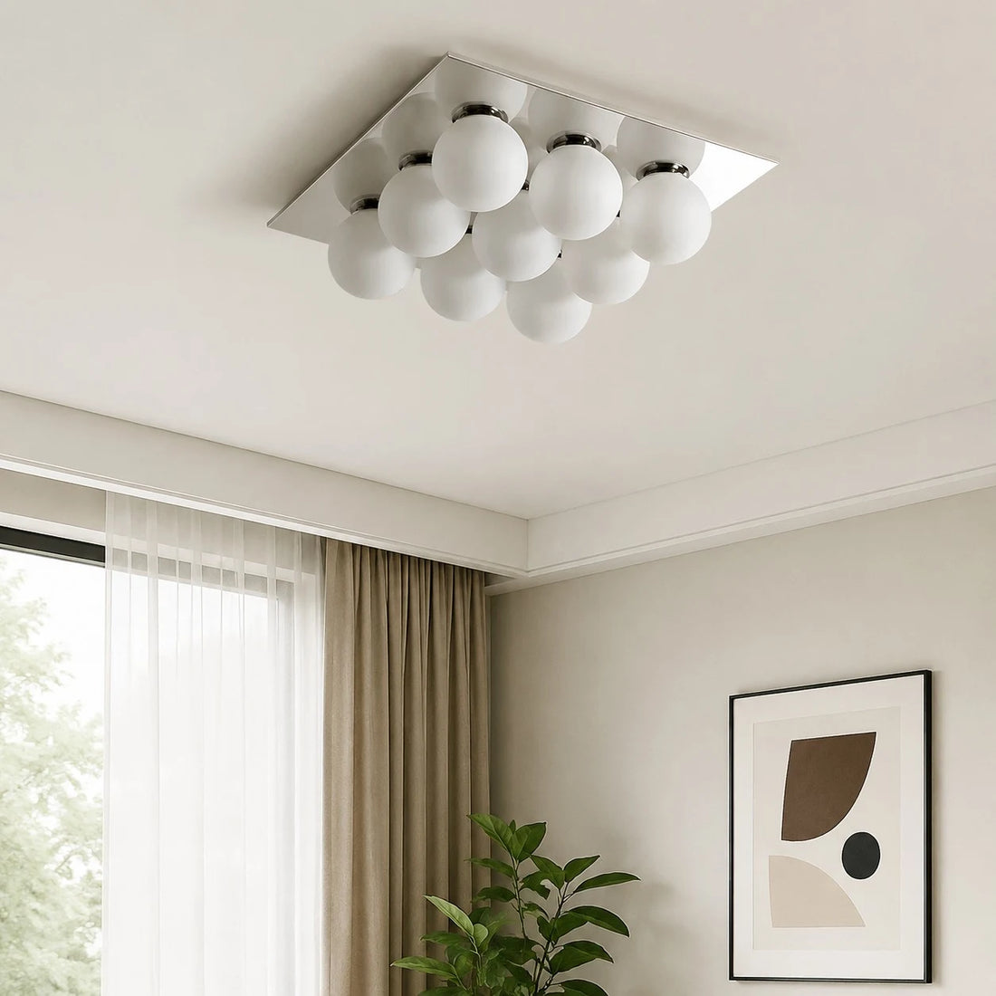 Gallery image: living room installation scene with plant and wall art.