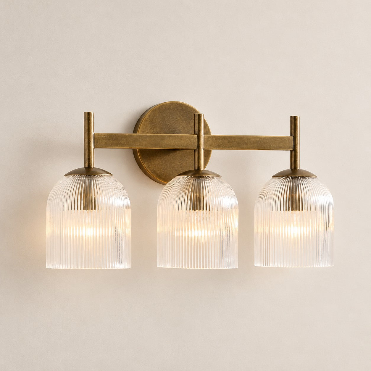 Bravira ribbed glass sconce, tumbled brass, 3 heads