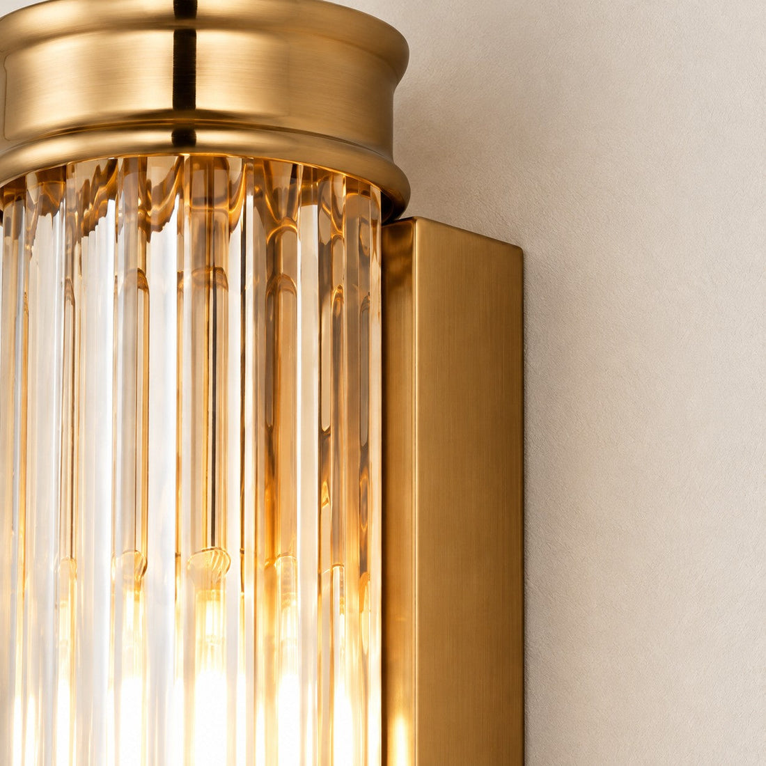 Close-up of the ribbed glass cylinder and filament bulbs