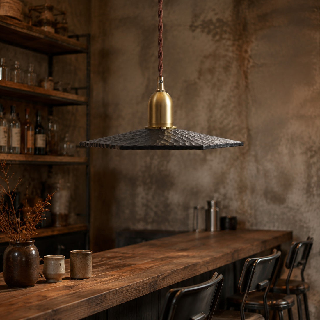 Octagonal wood pendant light installed over a dining table