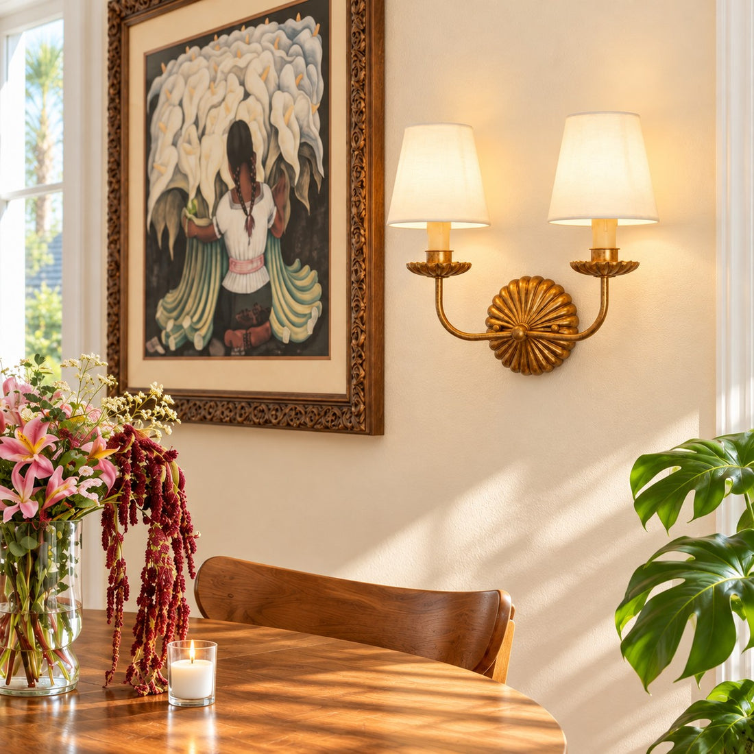 Catina double sconce styled in a dining room with art