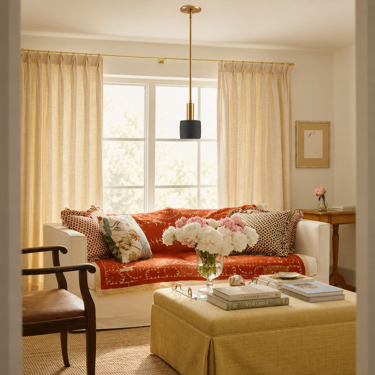 Black pendant styled in a sunlit living room