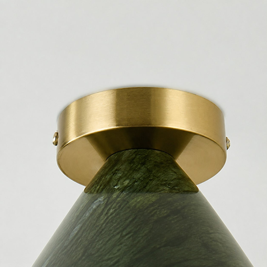 Close-up of ceiling canopy connection and jade-style shade texture