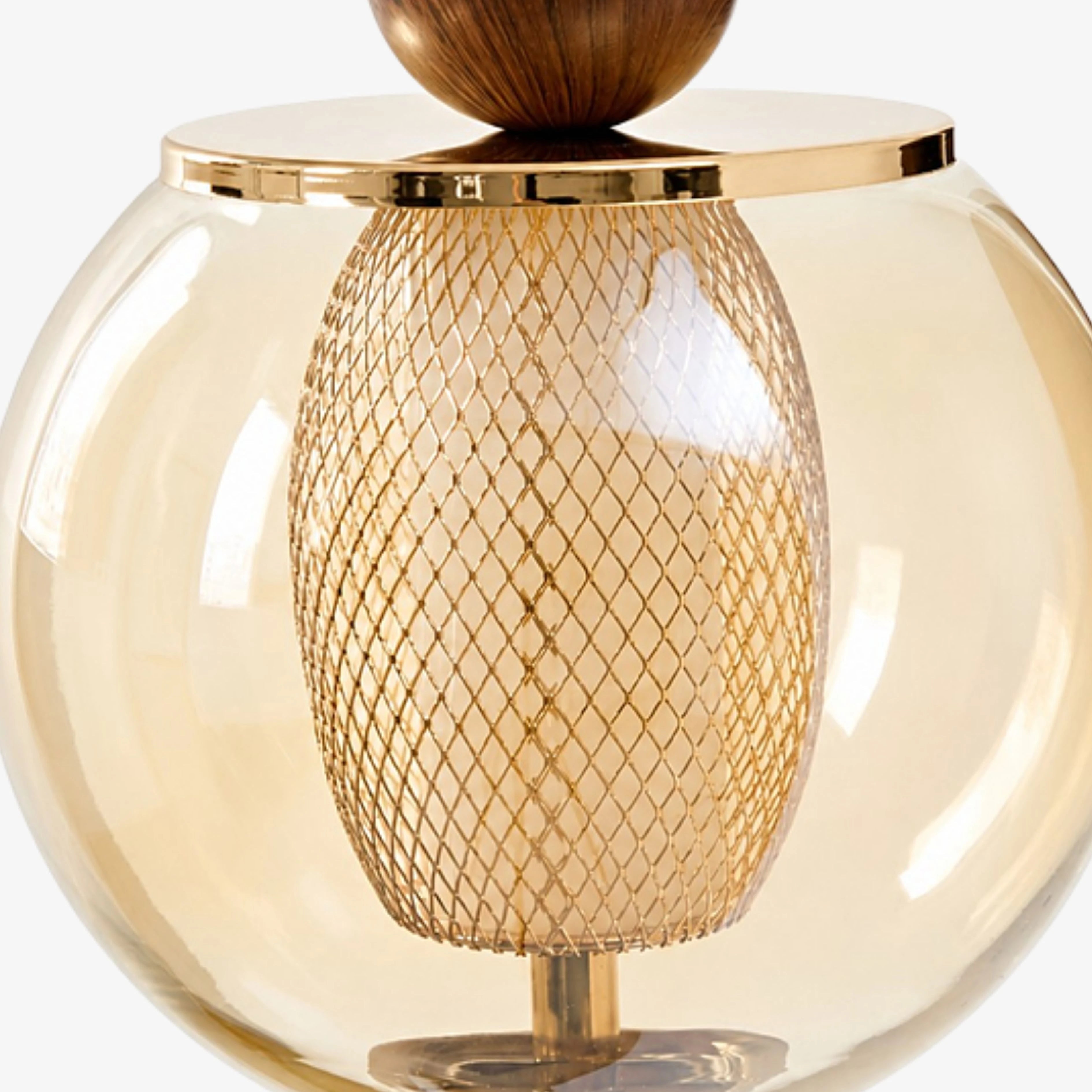 Amber glass globe and woven metal diffuser detail