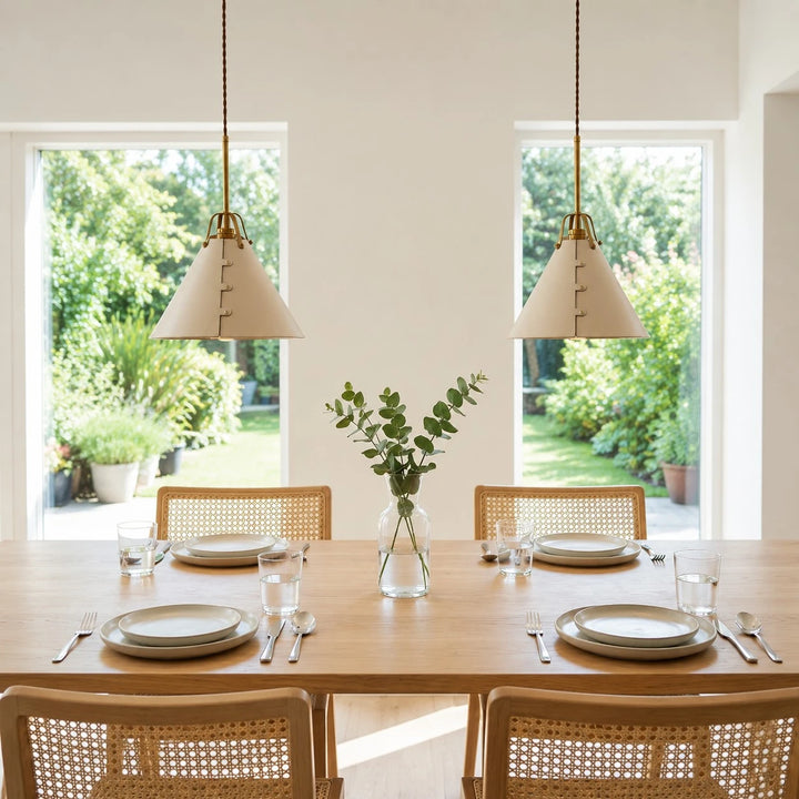 Leather pendant lights over a bright dining table