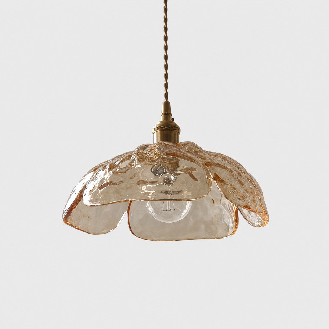 Single amber pressed-glass flower pendant with brass socket