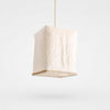 Sculptural linen pendant light on a clean light background