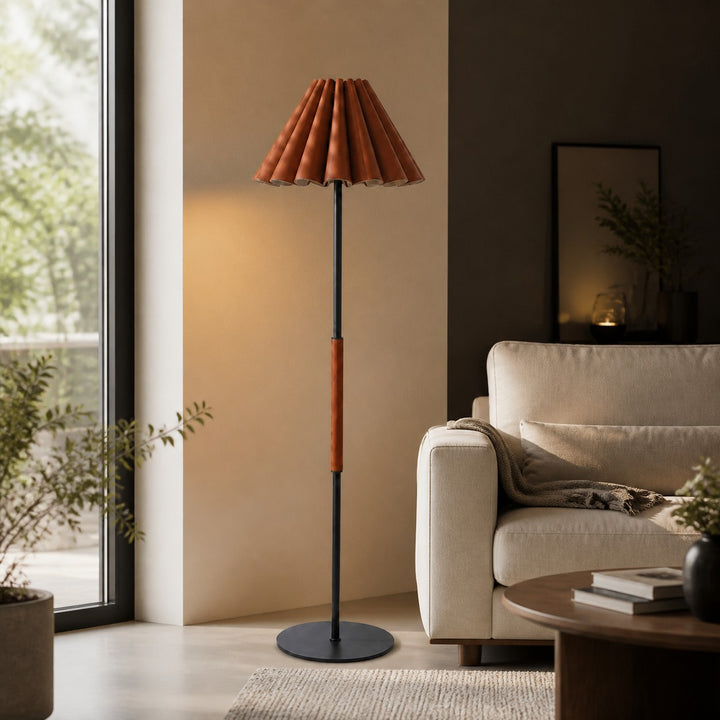 Pleated leather floor lamp beside brown leather seating