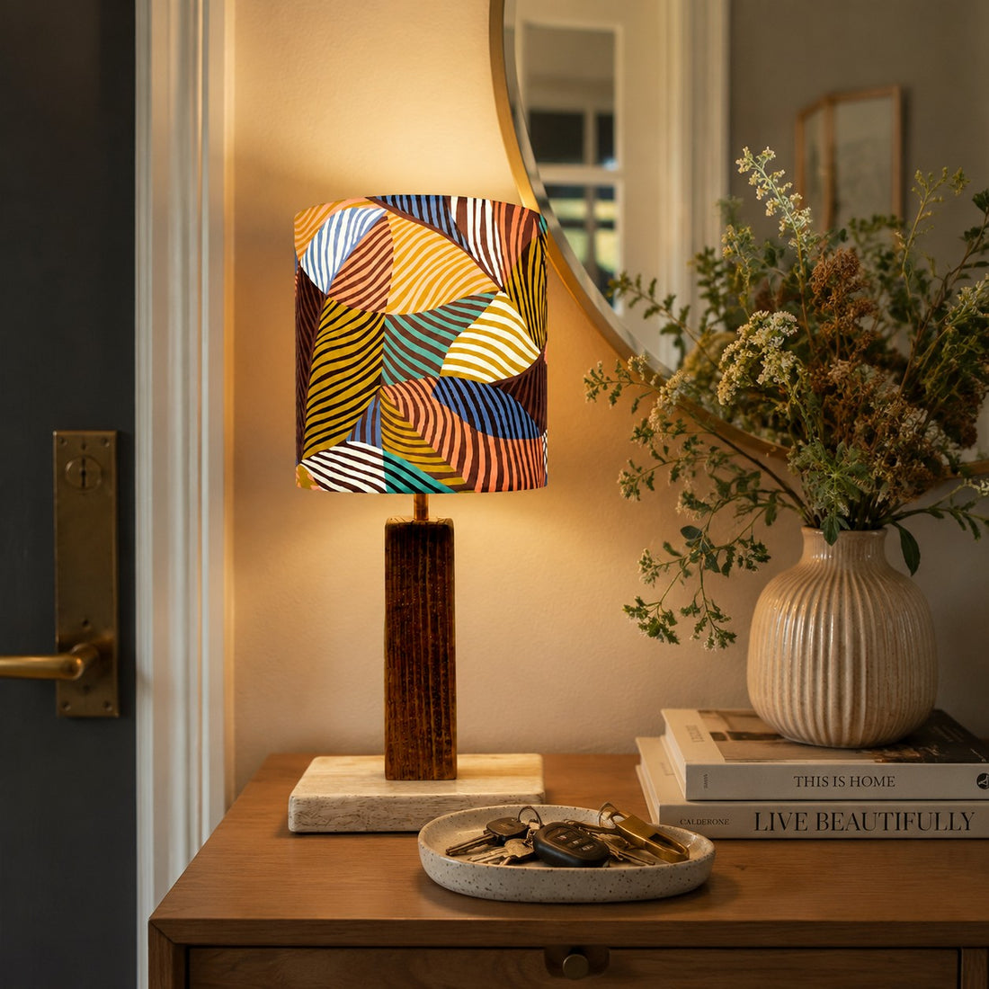 Colorful printed fabric table lamp in a styled interior