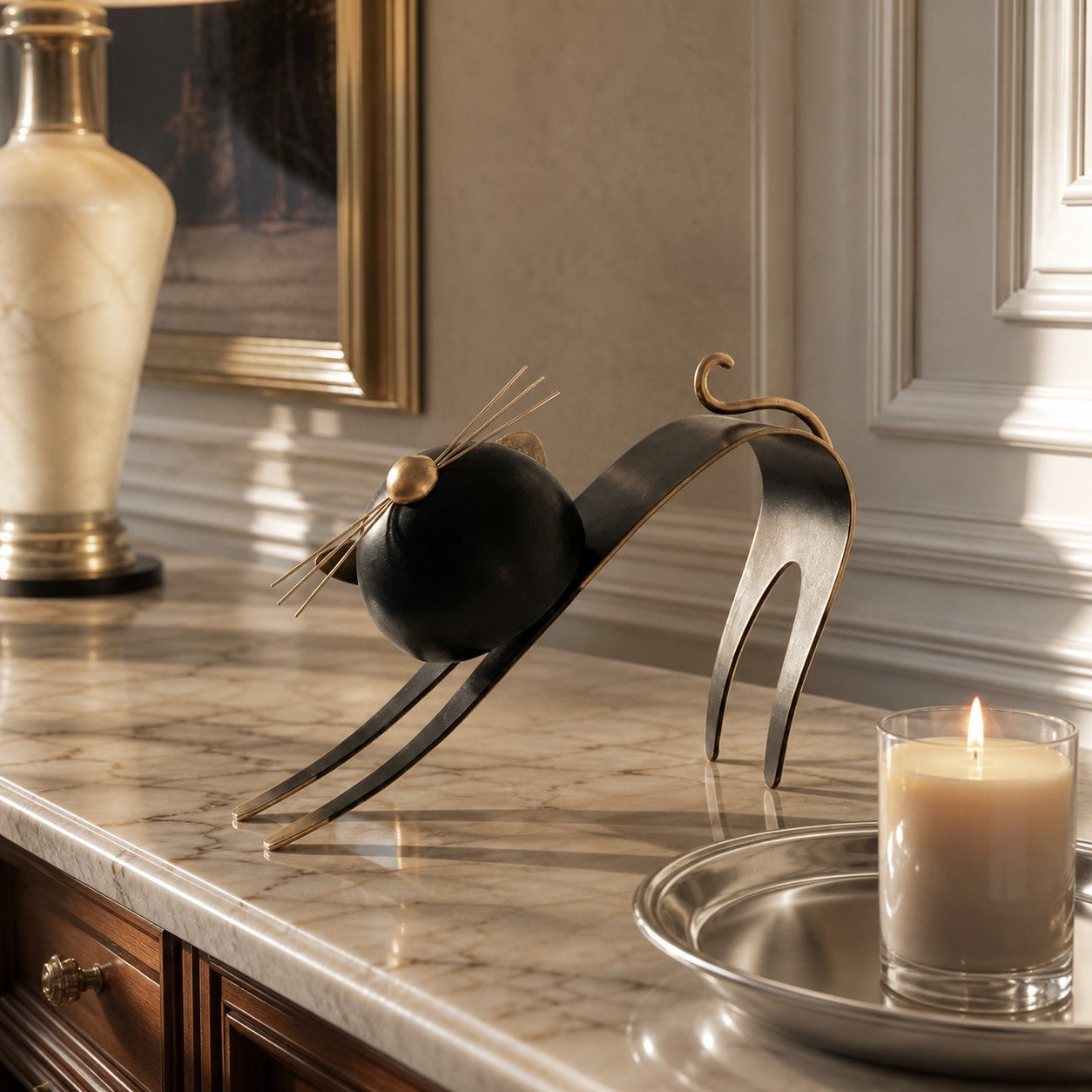 Felora sculptural metal cat figurine on a marble console