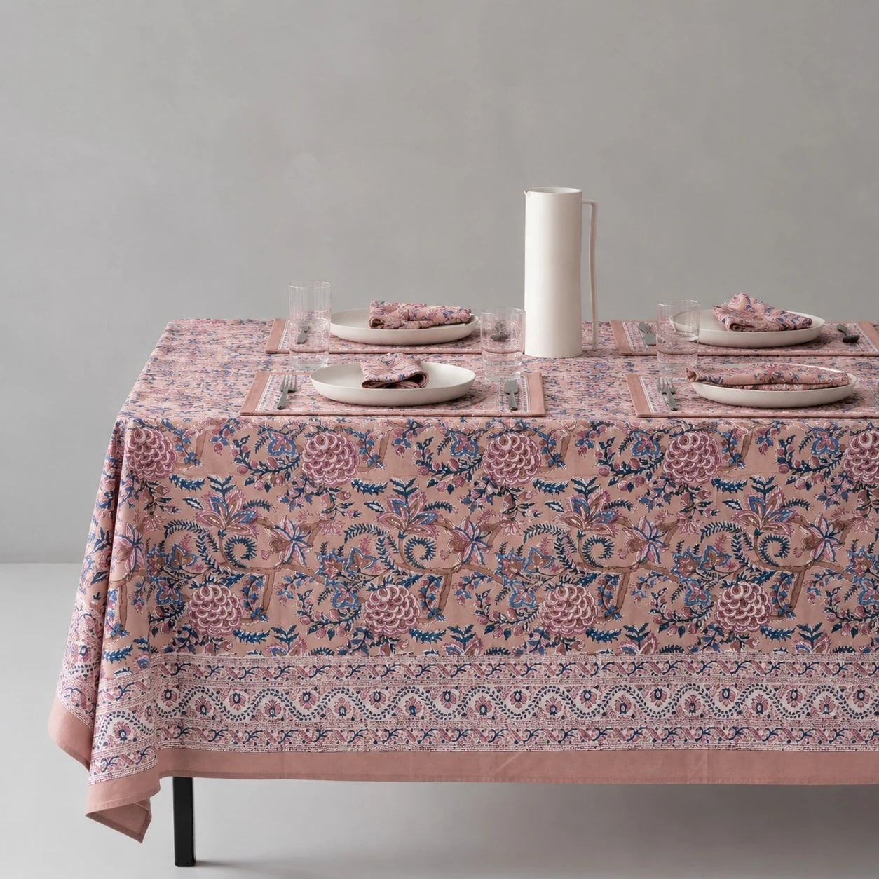 Rose mauve floral tablecloth on a dining table