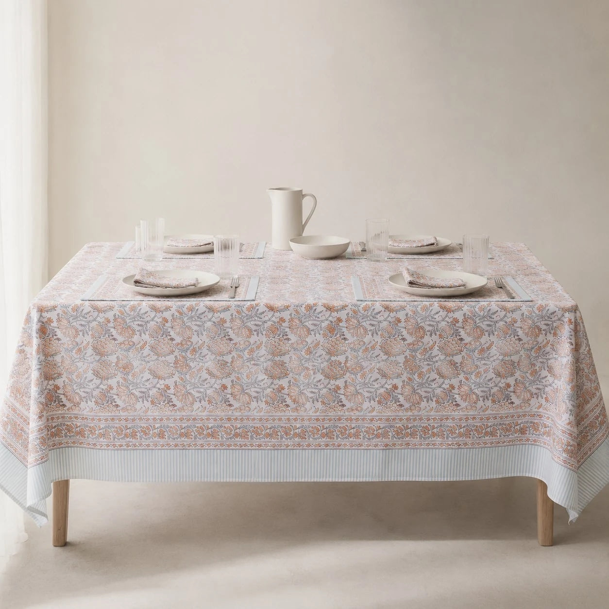 Mist blue floral tablecloth on a dining table