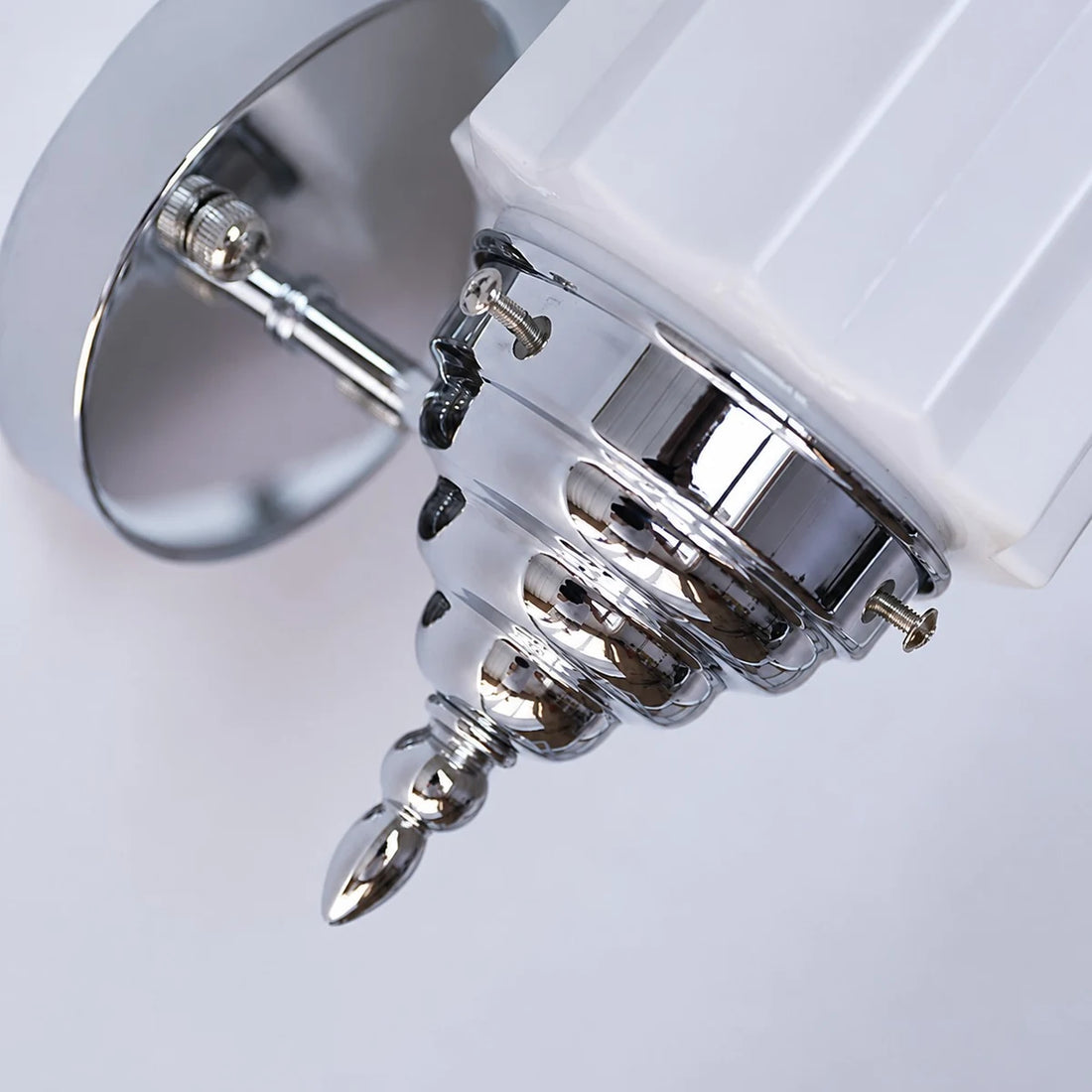 Chrome wall plate and decorative finial detail