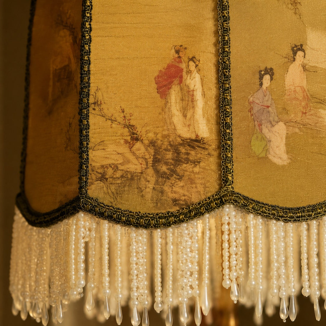 Close-up of chinoiserie fabric shade and beaded fringe