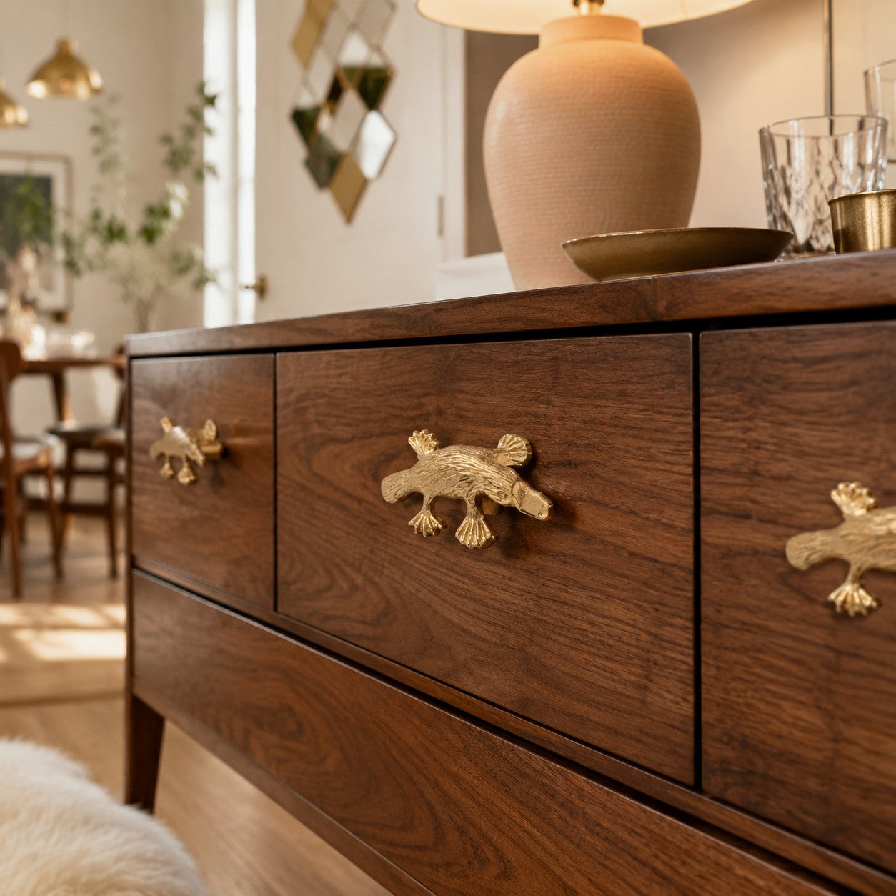 Primary Totem cabinet handles on warm wood dresser